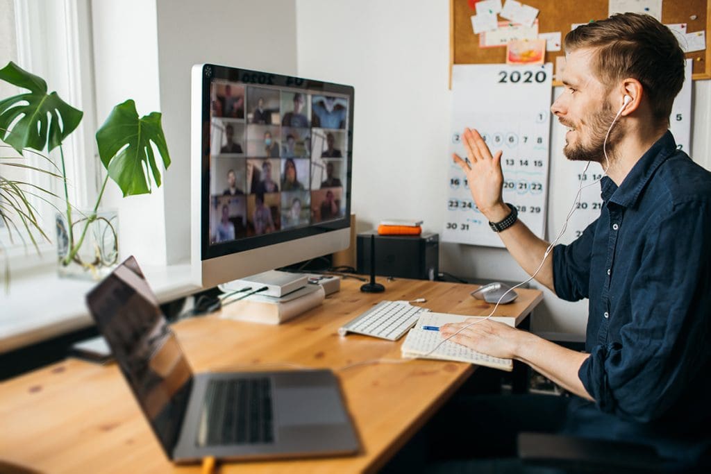 A remote employee on a virtual conference call.