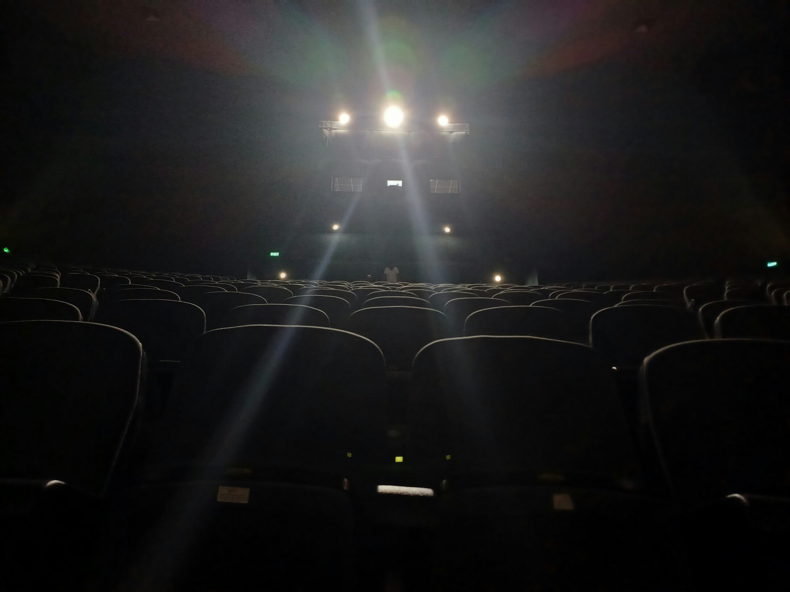An empty theater with the lights on