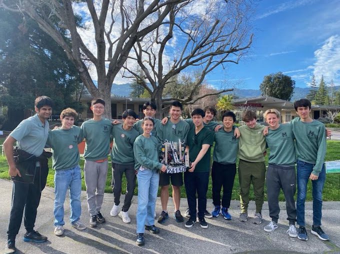 The miramonte high school robotics team holding up the robot they built that won 2nd place.