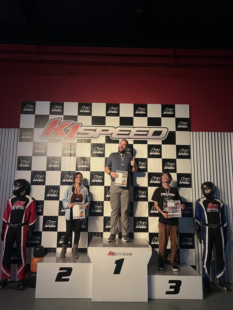 The top three professional PC racers from the second circuit, standing on the winners’ podium.